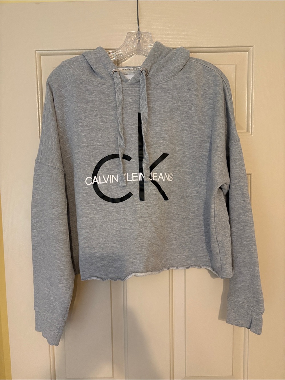 Calvin Klein Jeans Light Gray Cropped Hoodie with Black CK Logo